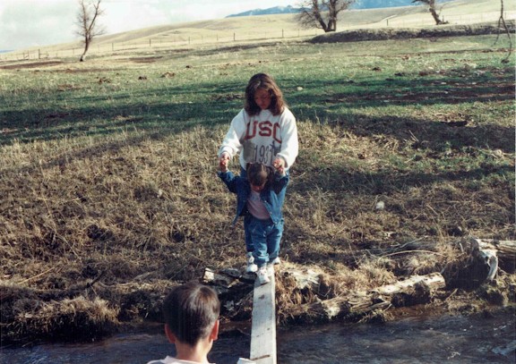 Tami and kids crossing the creek